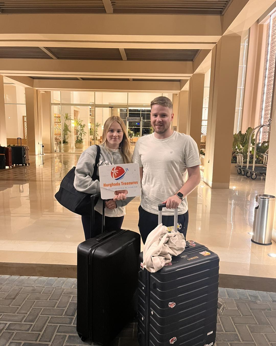 Couple with suitcases after their private transfer to Jaz Elite Astira Hurghada